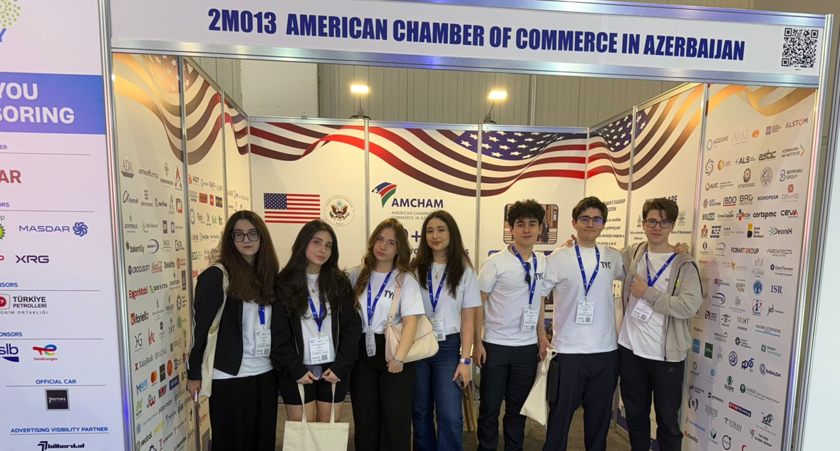 Youth Collective members together at the American Chamber of Commerce stand during Azerbaijan Energy Week